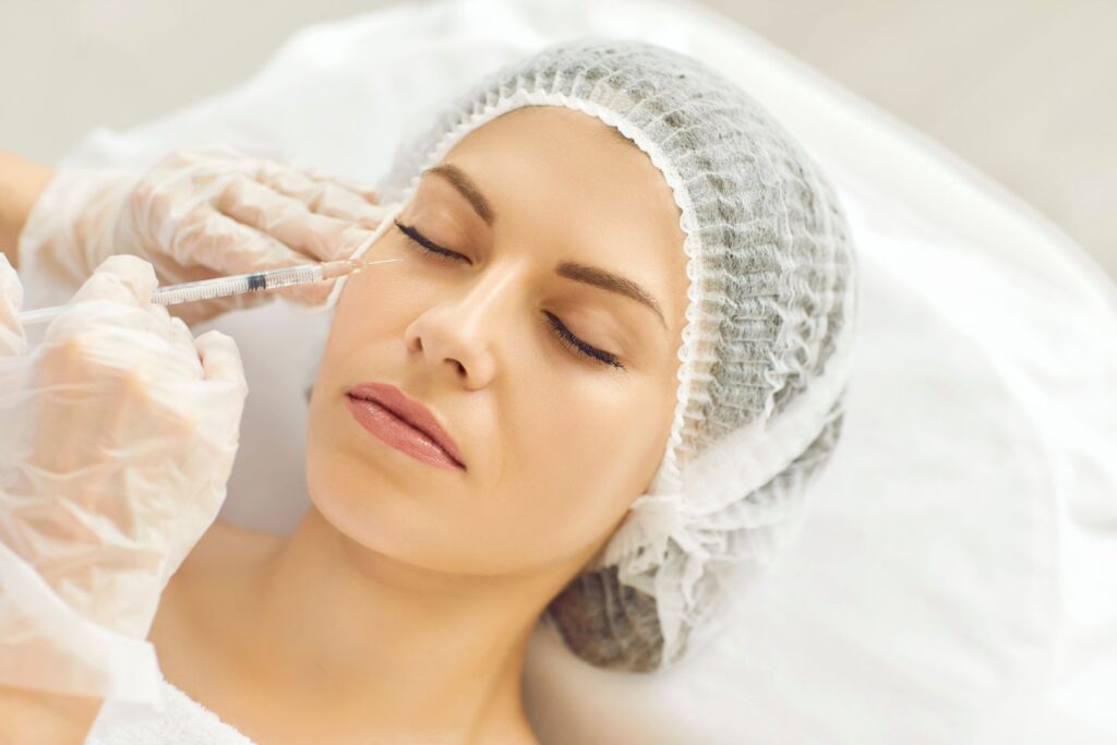 woman receiving under eye filler injection at a beauty clinic